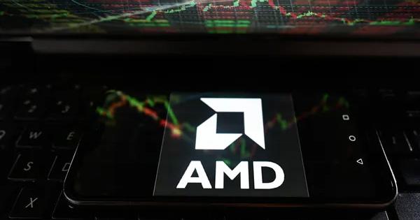 AMD logo on mobile phone sitting on laptop keyboar