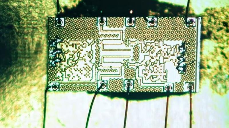 An enlarged image of the chip’s circuitry shows unusual patterns